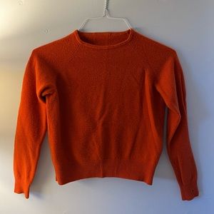 orange sweater